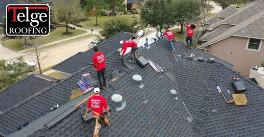 Telge contractors on a roof